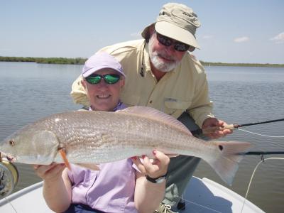 Bill Strike Admires a Fly Caught Redfish